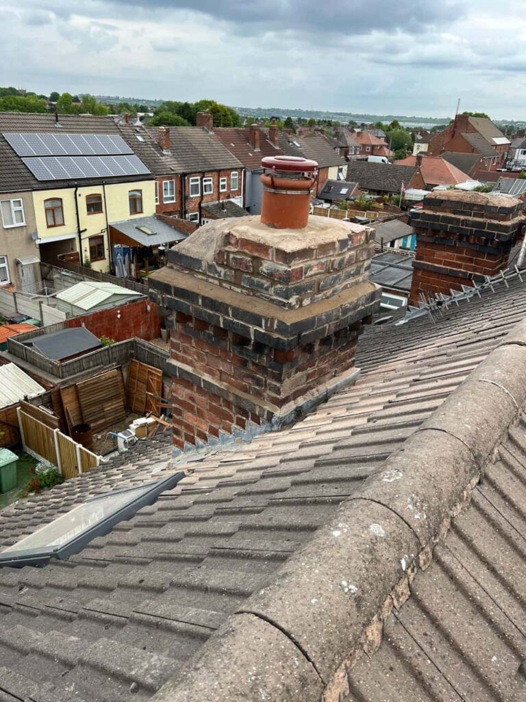 This is a photo taken from a roof which is being repaired by Erith Roofing Repairs, it shows a street of houses, and their roofs